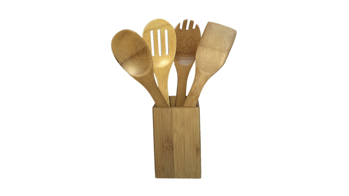 Four bamboo cooking utensils standing in a bamboo holder
